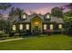 Charming brick home with manicured lawn, dormer windows, and inviting entryway at 1821 N Rock Springs Ne Rd, Atlanta, GA 30324