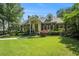 Charming brick home boasts a manicured lawn, mature trees, and inviting front entrance at 1821 N Rock Springs Ne Rd, Atlanta, GA 30324