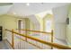 Bright hallway features wooden banister and neutral walls at 1821 N Rock Springs Ne Rd, Atlanta, GA 30324