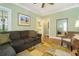 Bright living room featuring hardwood floors, a large mirror, and a cozy seating area at 1821 N Rock Springs Ne Rd, Atlanta, GA 30324