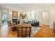 Open living room featuring hardwood floors, a cozy couch, and elegant decor at 1821 N Rock Springs Ne Rd, Atlanta, GA 30324
