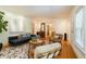 Spacious living room with hardwood floors, a stylish rug, and a comfortable couch at 1821 N Rock Springs Ne Rd, Atlanta, GA 30324