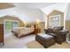 Comfortable main bedroom features a seating area and ample natural light at 1821 N Rock Springs Ne Rd, Atlanta, GA 30324