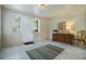 Mud room with tile floors, neutral-toned walls, a window, a dresser, and a chair at 1821 N Rock Springs Ne Rd, Atlanta, GA 30324