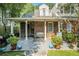 Outdoor patio with brick exterior, covered seating, and manicured landscaping at 1821 N Rock Springs Ne Rd, Atlanta, GA 30324