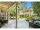 Covered patio with outdoor seating, views of the lush backyard, and beautiful landscaping at 1821 N Rock Springs Ne Rd, Atlanta, GA 30324