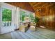 A cozy sunroom offers a relaxing atmosphere with outdoor views and comfortable seating at 1821 N Rock Springs Ne Rd, Atlanta, GA 30324
