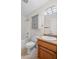 Well-lit bathroom with vanity, sink, toilet, cabinet, and shower at 208 Bruce Ct, Dallas, GA 30157