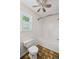 Bathroom featuring a tiled shower, toilet, neutral paint, and a window providing natural light at 208 Bruce Ct, Dallas, GA 30157