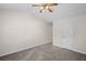 Spacious bedroom with neutral carpet, ceiling fan, vaulted ceiling, and window for natural light at 208 Bruce Ct, Dallas, GA 30157
