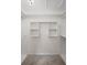 Spacious walk-in closet with custom shelving offers ample storage at 208 Bruce Ct, Dallas, GA 30157