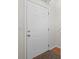 A view of a solid front door, showcasing classic panel design and brass hardware at 208 Bruce Ct, Dallas, GA 30157