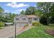 Charming home featuring a two-car garage, covered parking and a well-maintained lawn with manicured shrubbery at 208 Bruce Ct, Dallas, GA 30157