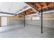 Spacious garage with concrete flooring, storage and convenient access door at 208 Bruce Ct, Dallas, GA 30157