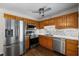 Updated kitchen with stainless steel appliances, granite countertops, and light-colored backsplash tile at 208 Bruce Ct, Dallas, GA 30157