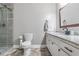 Bathroom featuring granite counter tops, stylish fixtures, and a glass-enclosed shower at 2136 Briarwood Ct, Snellville, GA 30078