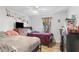 Cozy bedroom with two twin beds, ceiling fan, and natural light from the window at 2136 Briarwood Ct, Snellville, GA 30078