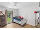 Bright bedroom with wood floors and large window at 2136 Briarwood Ct, Snellville, GA 30078