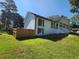 Beautiful home showcasing manicured lawn and a privacy fence, adding charm and security at 2136 Briarwood Ct, Snellville, GA 30078