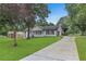 Lovely single-story home with a long driveway, beautiful lawn, and inviting curb appeal at 2136 Briarwood Ct, Snellville, GA 30078