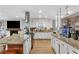 Well-lit kitchen with granite countertops, updated appliances, and seamless flow into the living area at 2136 Briarwood Ct, Snellville, GA 30078