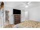 Main bedroom featuring wood floors and ensuite bathroom at 2136 Briarwood Ct, Snellville, GA 30078