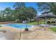 Backyard with in-ground swimming pool, covered gazebo, and outdoor furniture, perfect for entertaining at 2136 Briarwood Ct, Snellville, GA 30078