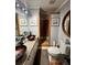 Bathroom features stylish vessel sinks, modern fixtures, and a separate glass-enclosed shower at 2194 Meadow Dr, Snellville, GA 30078