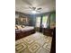 Bedroom featuring a ceiling fan, natural light, and ample space for a bed and furniture at 2194 Meadow Dr, Snellville, GA 30078