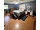 Spacious bedroom with hardwood floors, natural light, and cozy decor for comfortable living at 2194 Meadow Dr, Snellville, GA 30078