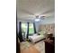 Bedroom featuring a ceiling fan, natural light, and neutral tones at 2194 Meadow Dr, Snellville, GA 30078