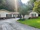 Charming single-story home with a welcoming entrance and well-maintained front yard at 2194 Meadow Dr, Snellville, GA 30078