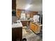 Functional kitchen featuring wood cabinets, laminate countertops, and moveable island at 2194 Meadow Dr, Snellville, GA 30078