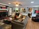 Inviting living room with a fireplace, comfortable seating, and view to the kitchen at 2194 Meadow Dr, Snellville, GA 30078