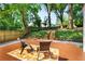 Inviting deck area with outdoor seating, lush trees, and a fenced backyard providing a tranquil setting at 103 Willow Wood Se Cir, Atlanta, GA 30317
