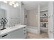 Bright bathroom with white cabinets, marble countertop, and tiled shower/tub at 103 Willow Wood Se Cir, Atlanta, GA 30317