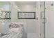 Close up of a bathroom featuring granite counters, a glass enclosed shower with decorative black tile accents at 103 Willow Wood Se Cir, Atlanta, GA 30317