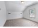 Bright, airy bedroom with neutral carpet, fresh white paint, one window, and a modern ceiling light fixture at 103 Willow Wood Se Cir, Atlanta, GA 30317