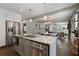 Open concept kitchen with island, stainless steel appliances, and view into living area at 103 Willow Wood Se Cir, Atlanta, GA 30317