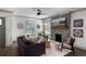 Bright living room with a modern fireplace, ample seating, and natural light at 103 Willow Wood Se Cir, Atlanta, GA 30317
