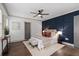 Beautiful main bedroom featuring panel accent wall, ceiling fan, and hardwood floors at 103 Willow Wood Se Cir, Atlanta, GA 30317
