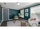 Office space with large windows, neutral rug, and green accent walls at 103 Willow Wood Se Cir, Atlanta, GA 30317
