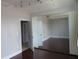 Bedroom with hardwood floors, closet doors, and a doorway to another room at 115 W Peachtree Nw Pl # 702, Atlanta, GA 30313