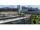 Apartment building with rooftop AC units, and a view of the city skyline at 115 W Peachtree Nw Pl # 702, Atlanta, GA 30313