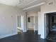 Hallway with hardwood floors leading to various rooms, including a bathroom at 115 W Peachtree Nw Pl # 702, Atlanta, GA 30313
