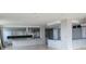 Open concept kitchen featuring an island, granite counters, and sleek white cabinets at 115 W Peachtree Nw Pl # 702, Atlanta, GA 30313