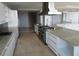 Spacious kitchen featuring granite countertops, stainless steel appliances, and tile flooring at 115 W Peachtree Nw Pl # 702, Atlanta, GA 30313