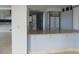 Open kitchen with breakfast bar, neutral cabinets, and granite countertops at 115 W Peachtree Nw Pl # 702, Atlanta, GA 30313