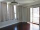 Bright living room with hardwood floors, neutral walls, and balcony access at 115 W Peachtree Nw Pl # 702, Atlanta, GA 30313