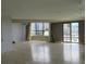 Spacious living room with tile flooring, large windows, and city views at 115 W Peachtree Nw Pl # 702, Atlanta, GA 30313